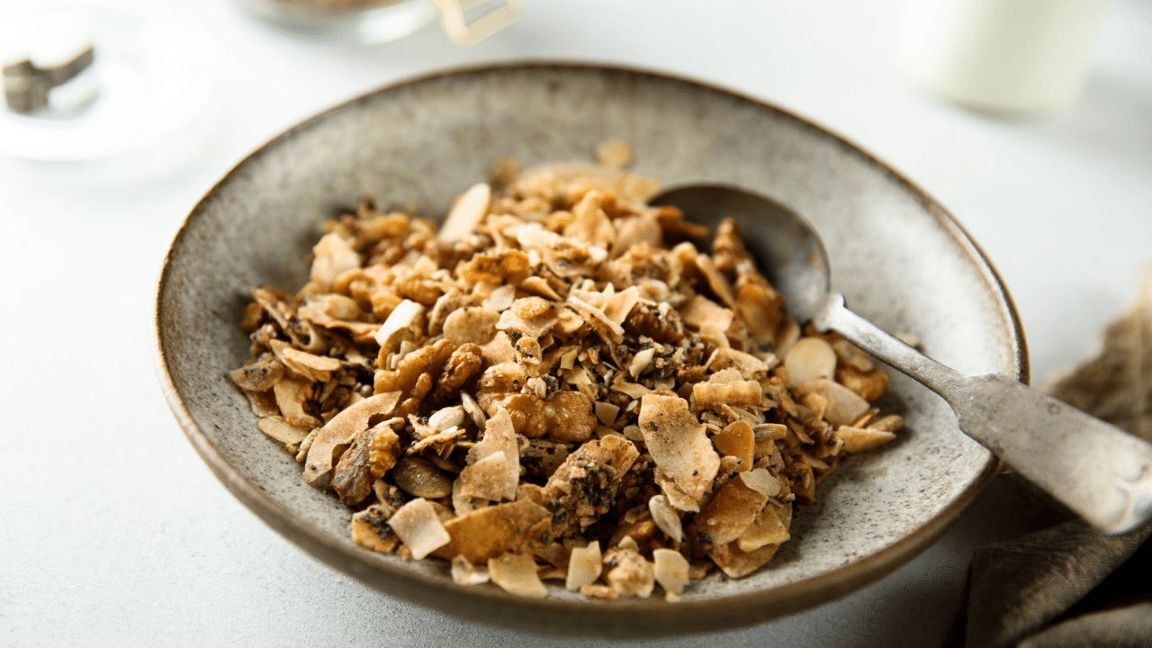 recipe for a bowl of grain free granola with dried blueberries